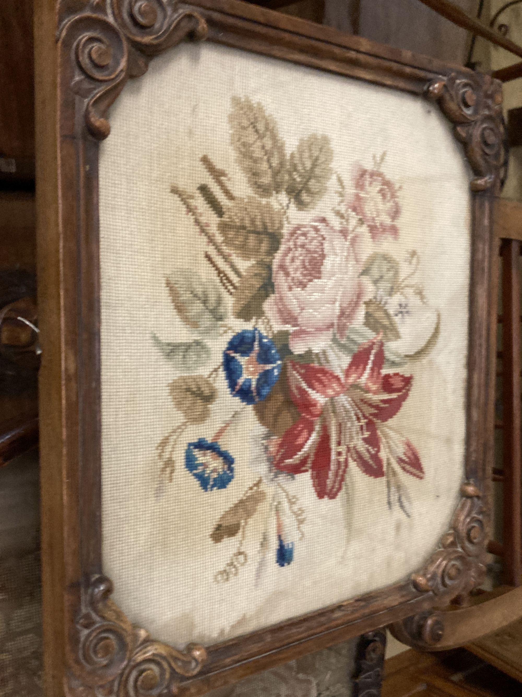 A Victorian rosewood table, with square floral tapestry inset top, over fluted bulbous pillar and triform platform base, height 63cm to